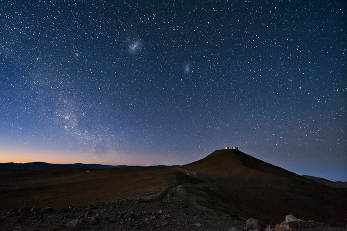 Observatory on a hill under a starry night sky