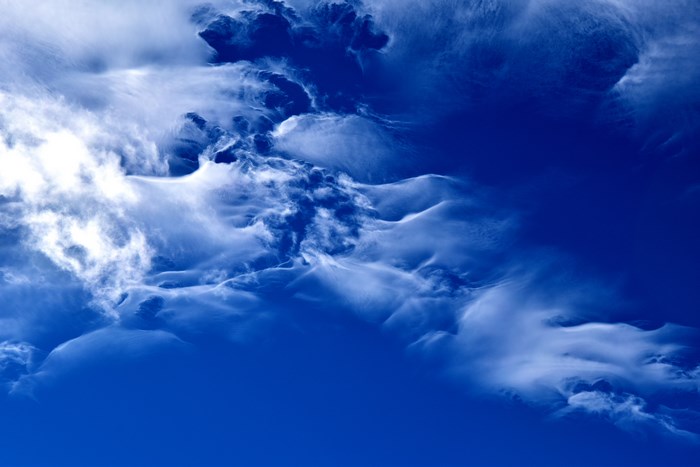 Ethereal Wispy Clouds in Deep Blue Sky
