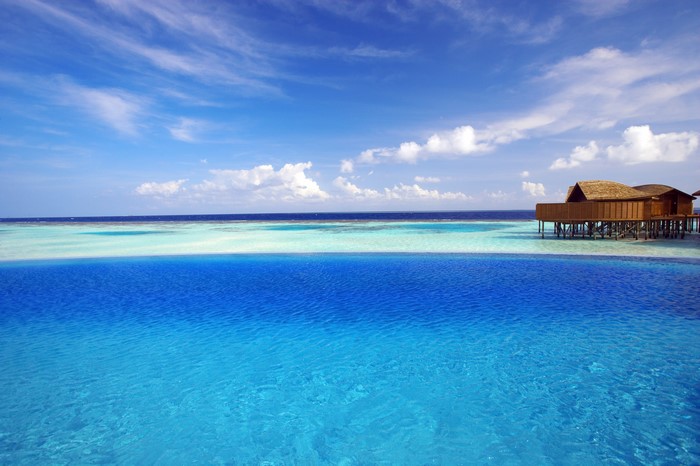 Tropical Overwater Bungalows in Maldives Ocean