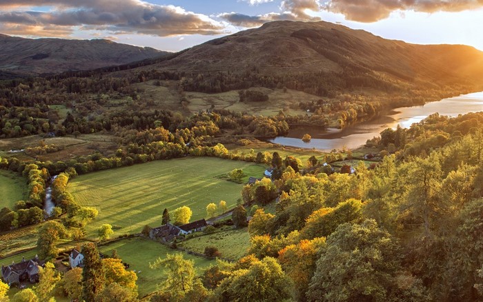 Aerial view of Scottish landscape with mountains and lake
