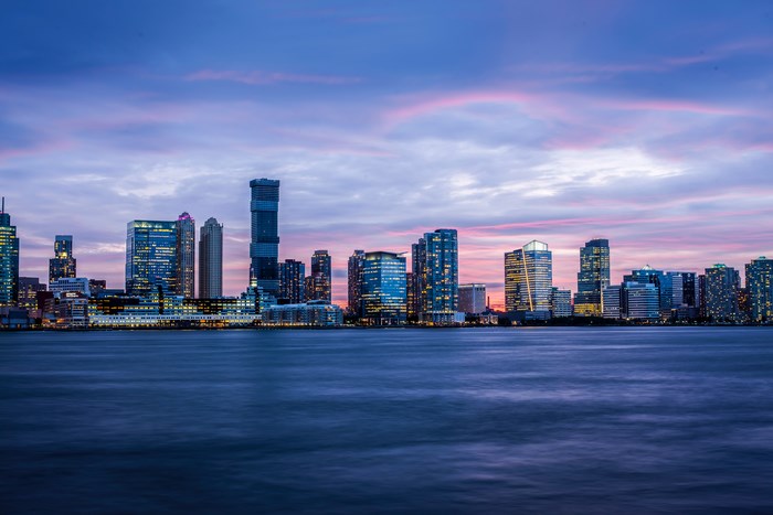 Jersey City skyline at dusk over the water