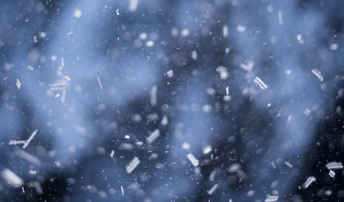 Snowing with blue smoke and bokeh