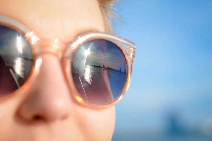 Reflection of Detroit skyline in sunglasses