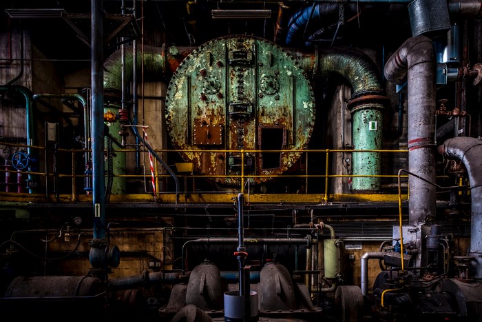Abandoned industrial factory interior with machinery