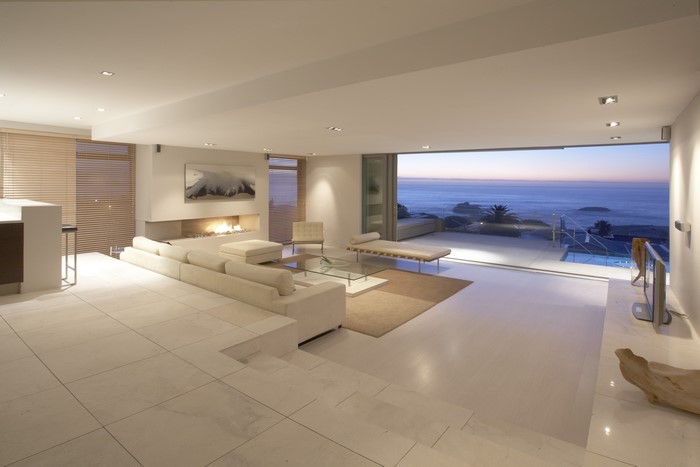 Modern living room with fireplace and ocean view