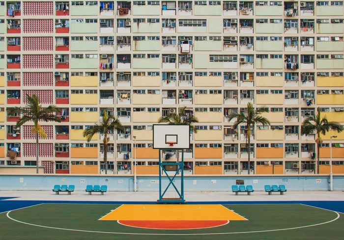 Colorful apartment buildings and basketball court in Hong Kong