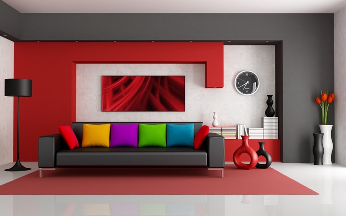 Modern living room with black sofa and colorful pillows