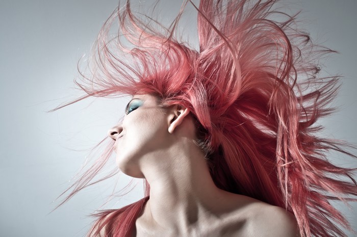 Woman with pink hair and makeup