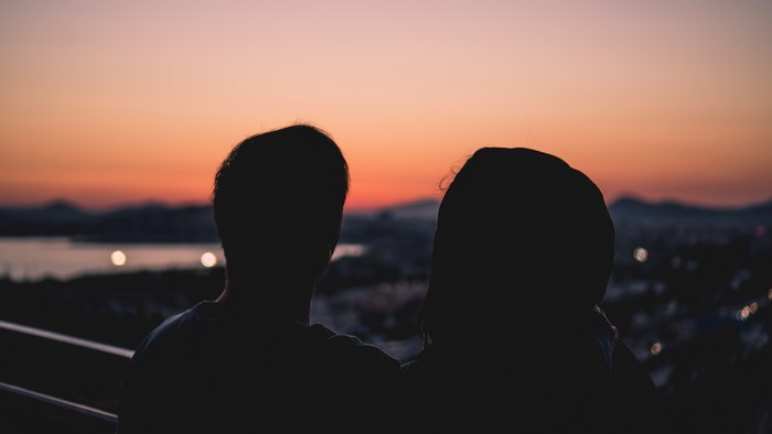 Couple watching sunset over Athens