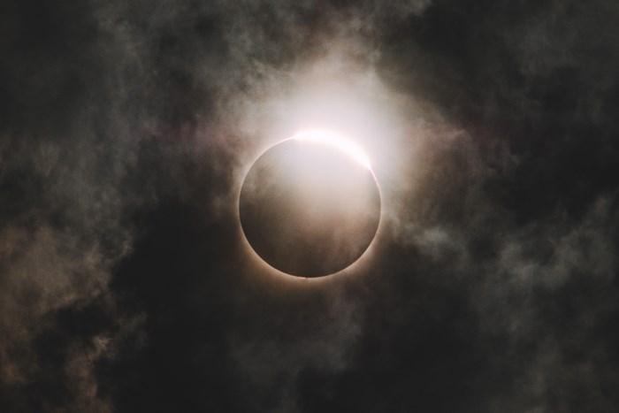 Solar Eclipse with Diamond Ring and Cloud Cover