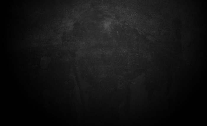 Dark textured background with subtle spots