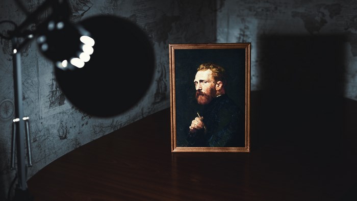 Vincent van Gogh painting illuminated by a spotlight