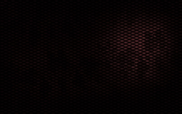 Dark textured mesh surface