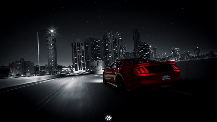 Red Ford Mustang driving in The Crew 2 at night