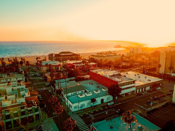 Aerial view of a coastal town at sunset