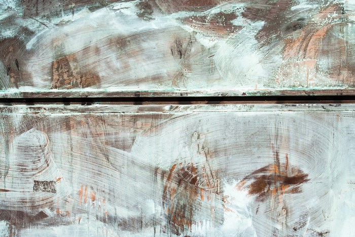 Abstract textured metal with white paint