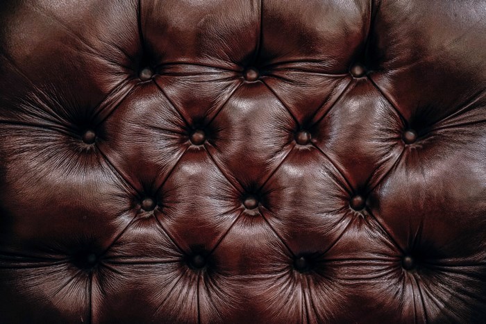 Brown tufted leather upholstery texture