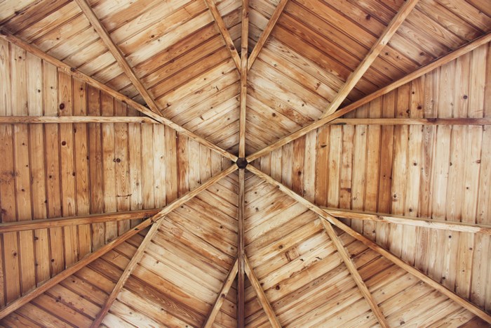 Wooden gazebo ceiling structure with radial beams