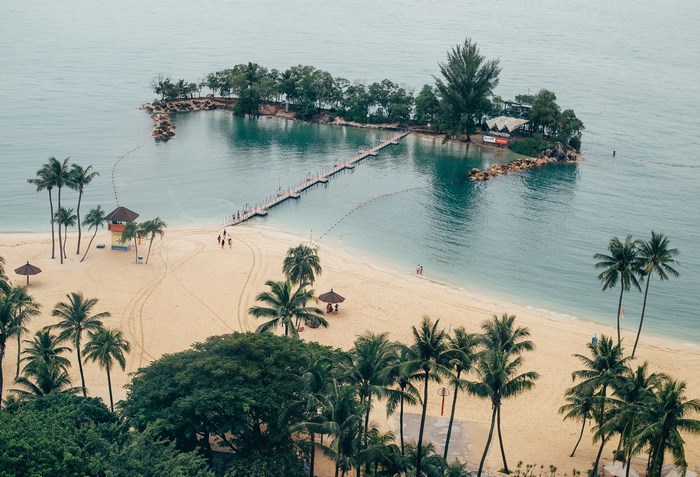 Tropical island with a pier and sandy beach
