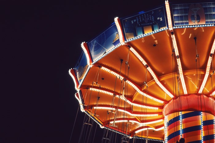 Colorful carnival swing ride at night