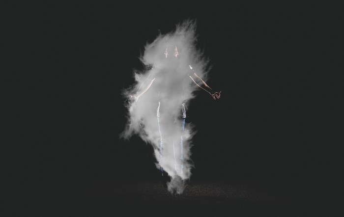 Person engulfed in smoke with arms outstretched