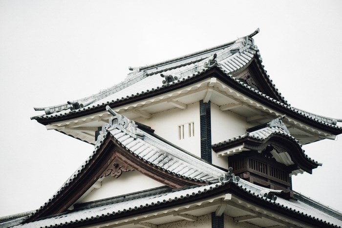 Traditional Japanese castle roof with snow