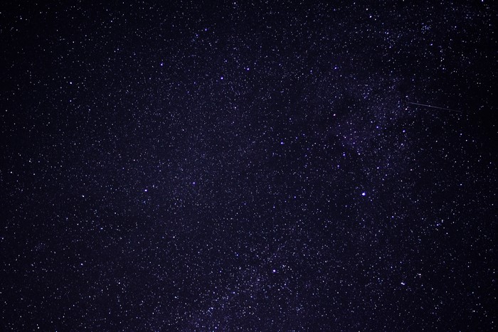Starry night sky with a meteor