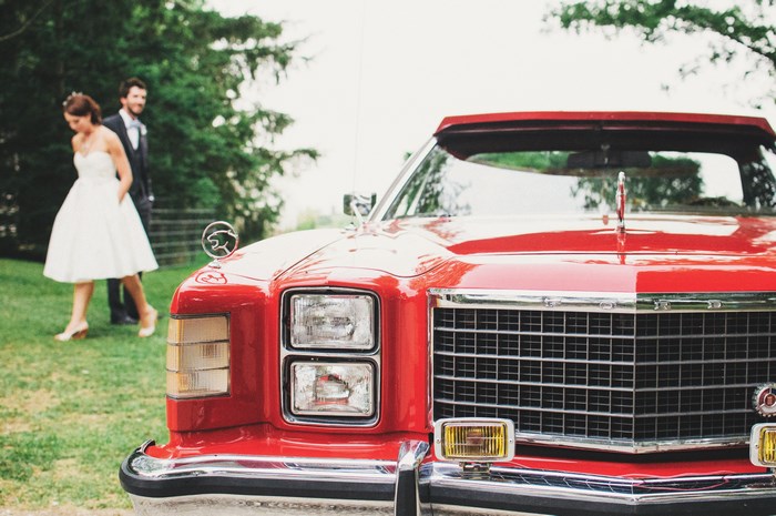 Bride and Groom with Classic Red Car