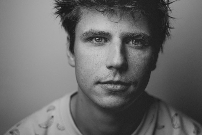 Black and white portrait of a man with short hair