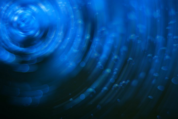 Abstract blue swirls and bokeh
