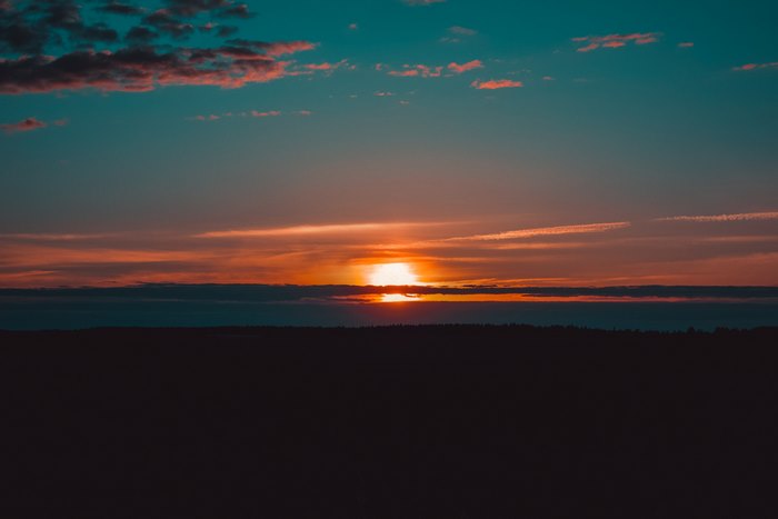 Sunset over a dark landscape