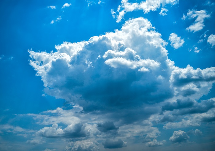 Blue sky with white and dark clouds