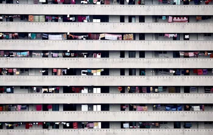 Apartment building with clothes hanging on balconies