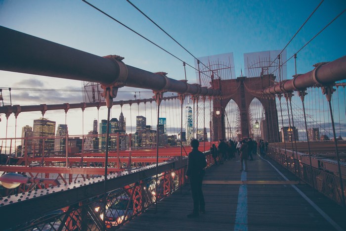 Brooklyn Bridge at dusk with New York City skyline