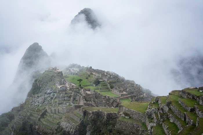 Machu Picchu ruins shrouded in fog
