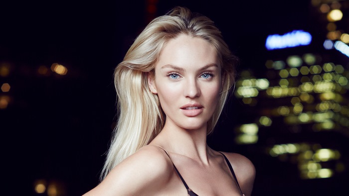 Candice Swanepoel portrait with city lights