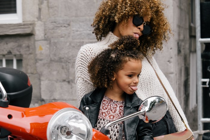 Mother and daughter on a scooter