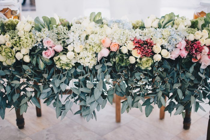 Wedding floral arrangement with roses and eucalyptus