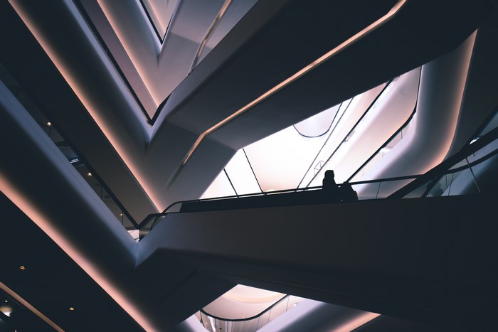 Modern architecture with a person on an escalator in Bangkok