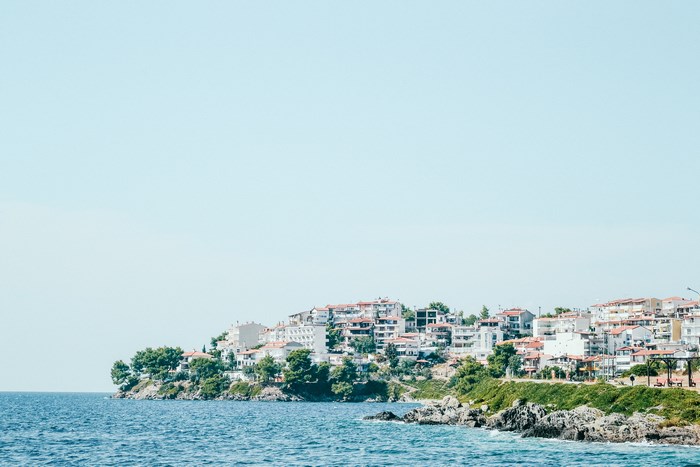 Coastal town with white buildings and blue ocean
