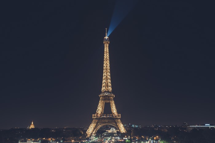Eiffel Tower illuminated at night in Paris