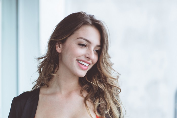 Celine Farach Smiling Woman with Wavy Hair 4K