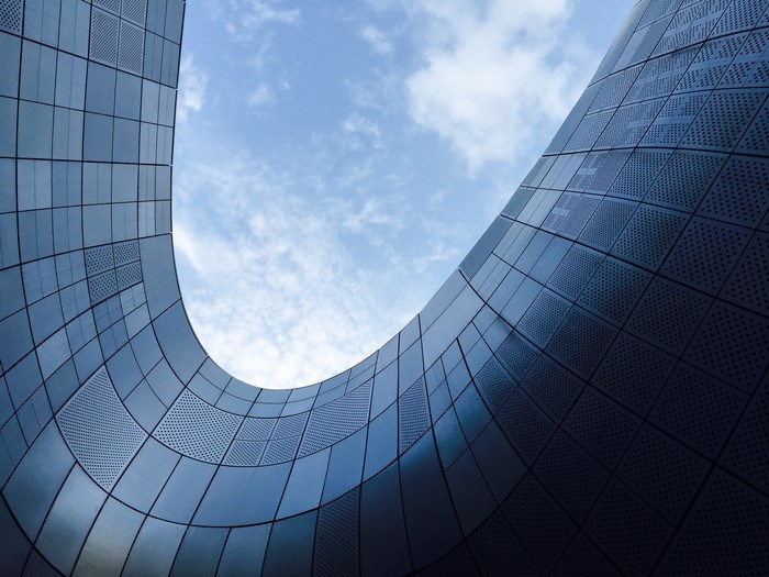 Modern architecture with curved steel and glass facade