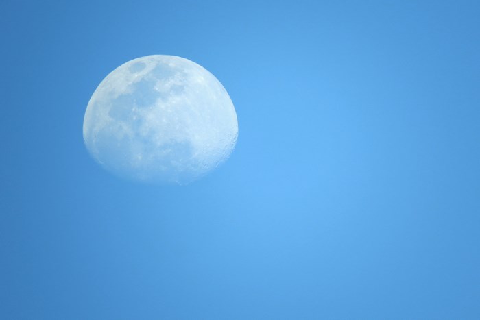 The Moon in a Clear Blue Sky