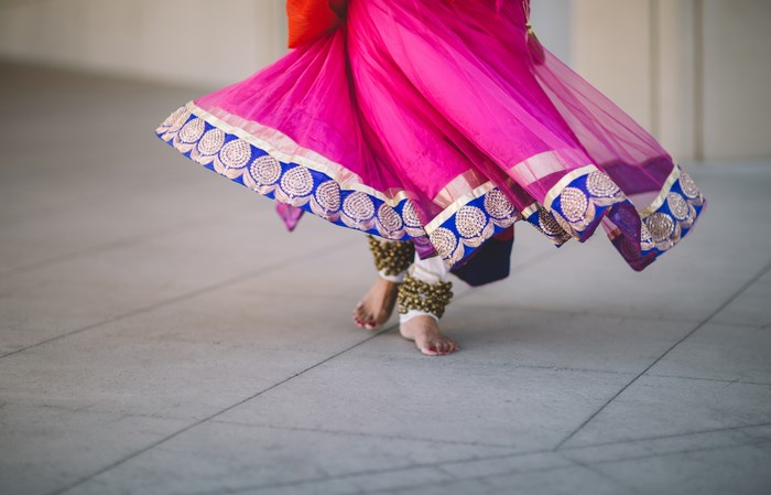 Indian dancer in pink skirt with anklets