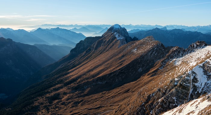 Mountain range with snow and autumn colors near Tarvisio