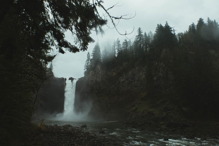 Misty waterfall in a dark forest