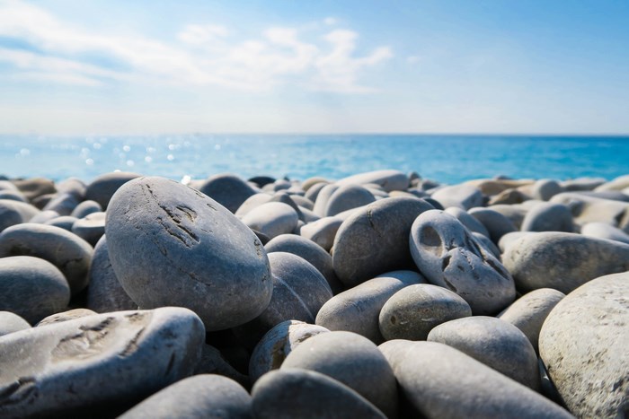 Pebble beach with the ocean and sky