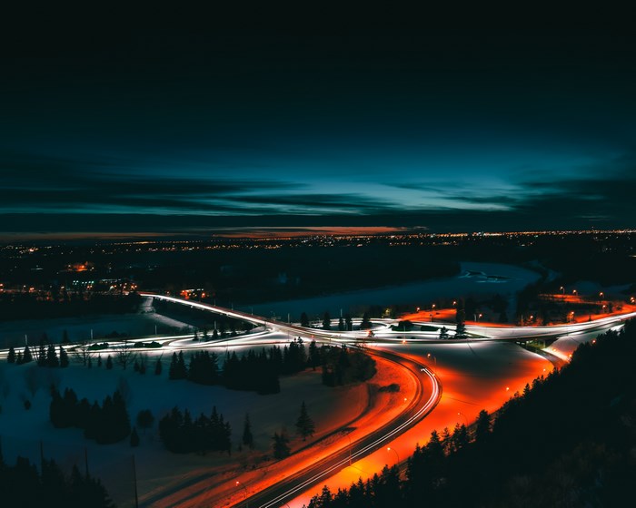 Aerial view of a highway interchange at night in winter