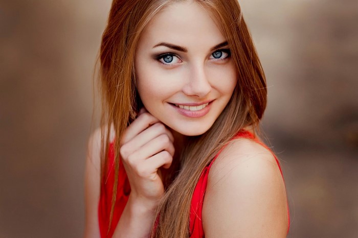 Smiling Blonde Girl with Blue Eyes